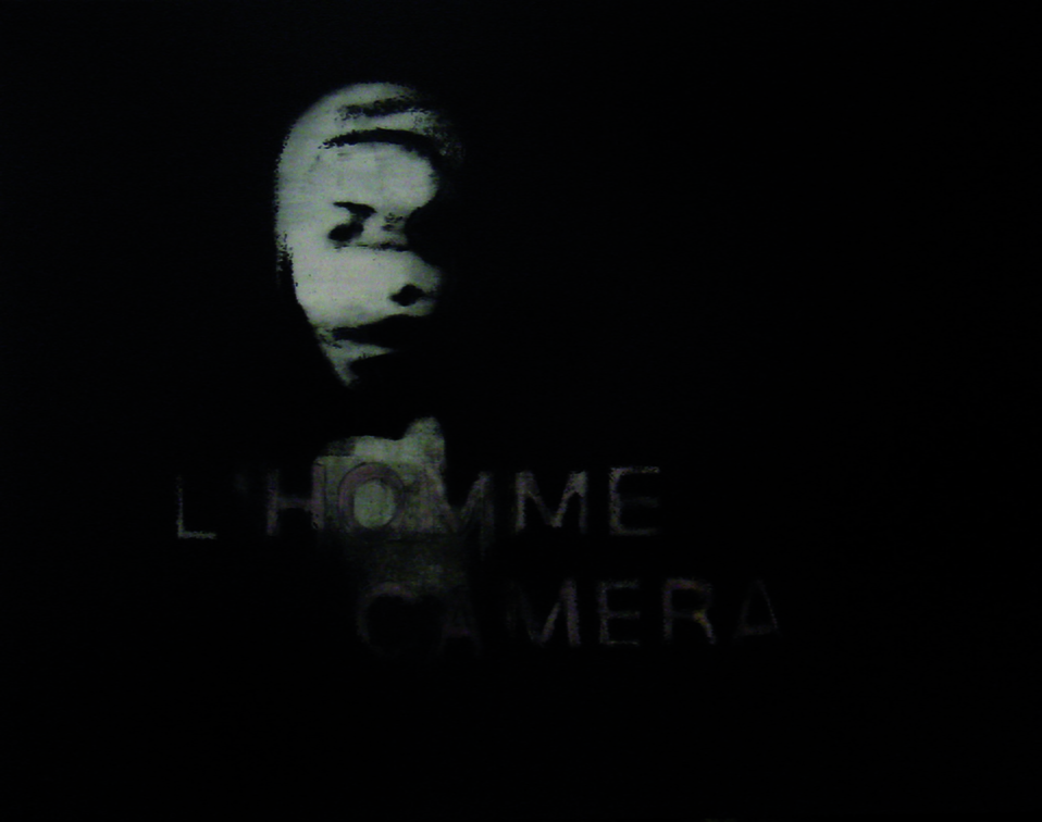 (T0700) L’homme caméra, 2009, acrylique sur toile, 114 x 146 cm (18053 visites) (T0700) L’homme caméra, 2009, acrylique sur toile, 114 x 146 cm